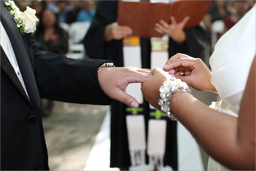 bride-putting-ring-on-groom